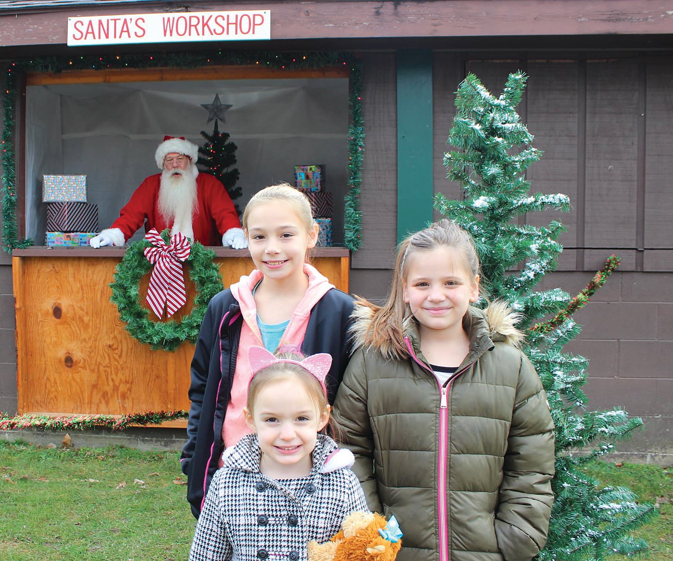 Keirstyn, Keiarra and Kinly Archer visit with Santa.