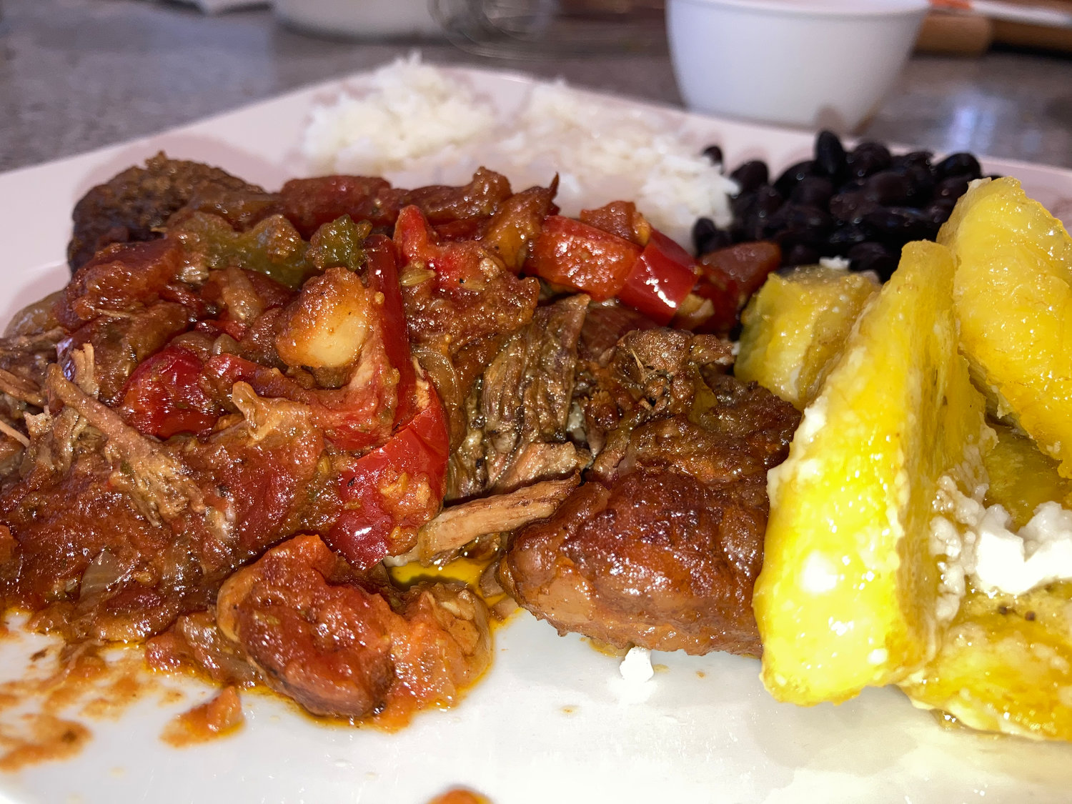Ropa Vieja is a Cuban dish made with beef, vegetables and sauce.
