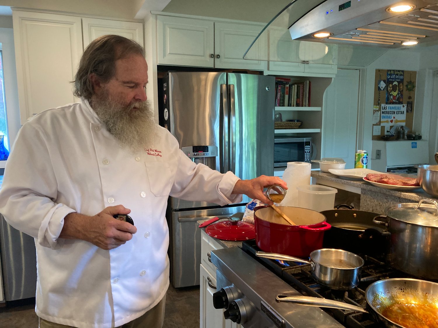 Richard Warner, a Wabash College professor and former professional chef, gives a cooking demonstration during an "After the Bell" event for college alumni.