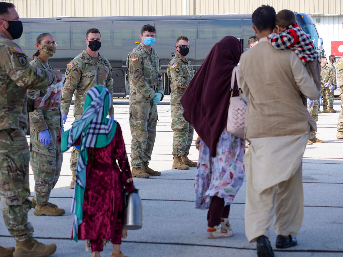 Afghan refugees arrive last week at Camp Atterbury.