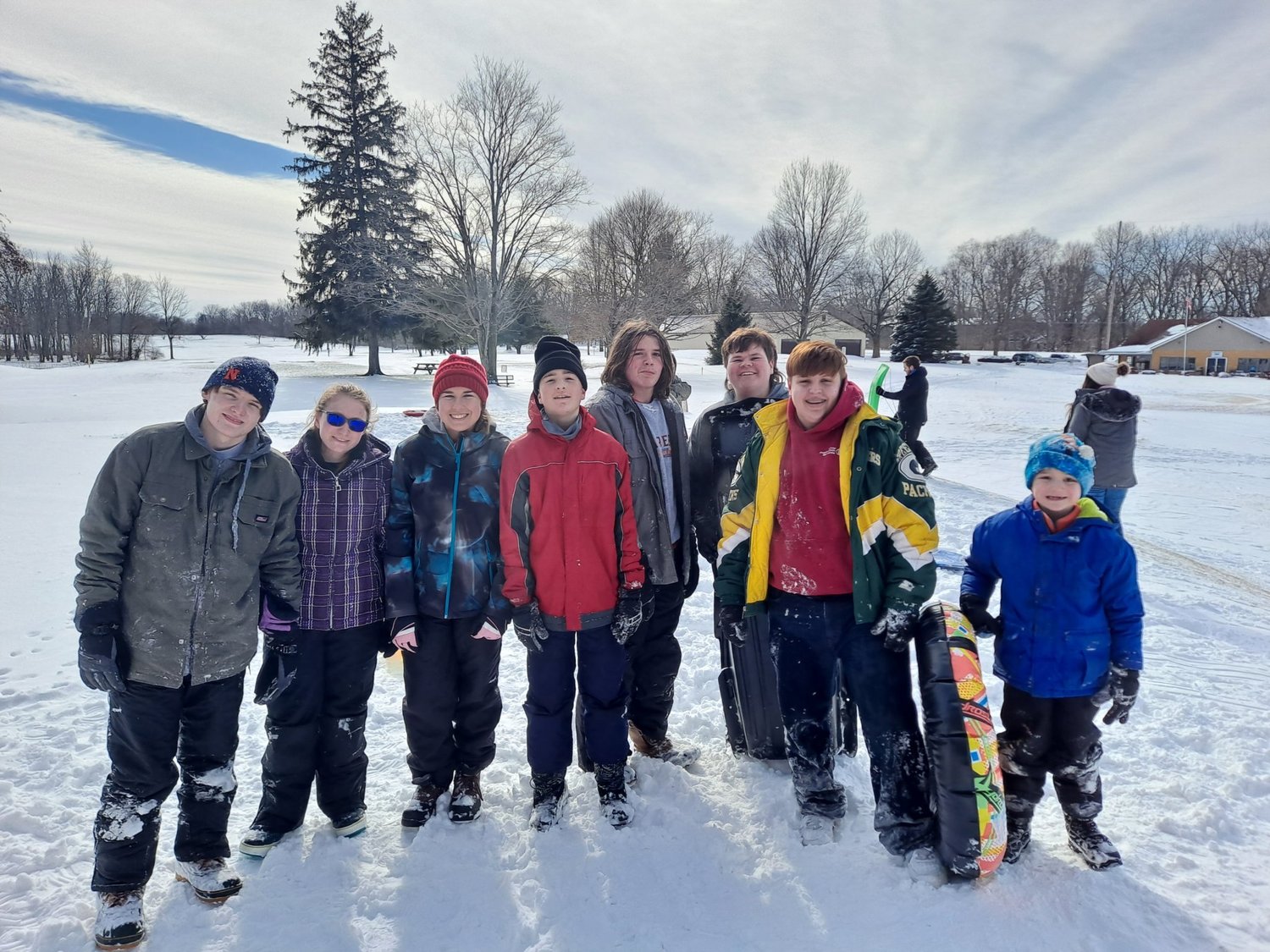 Wil, Makayla, Courtney, Donovan, Colin, Cale, Harmon and Alex after sledding the hills at the Crawfordsville Municipal Golf Course on Friday afternoon.