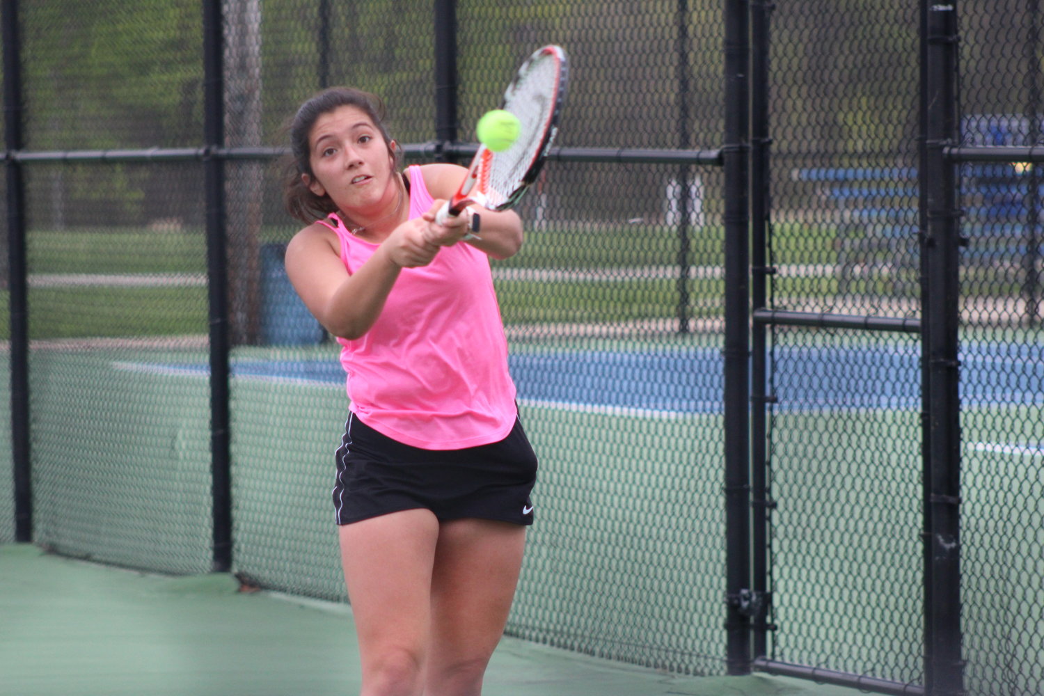Emily Jimenez returns a serve during her match at one doubles for the Mustangs.