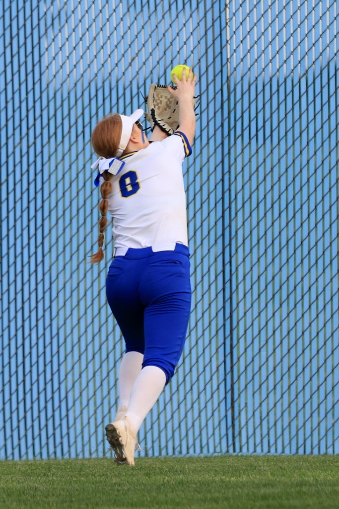Laine Schlicher makes a terrific snag out in left field for the Athenians.