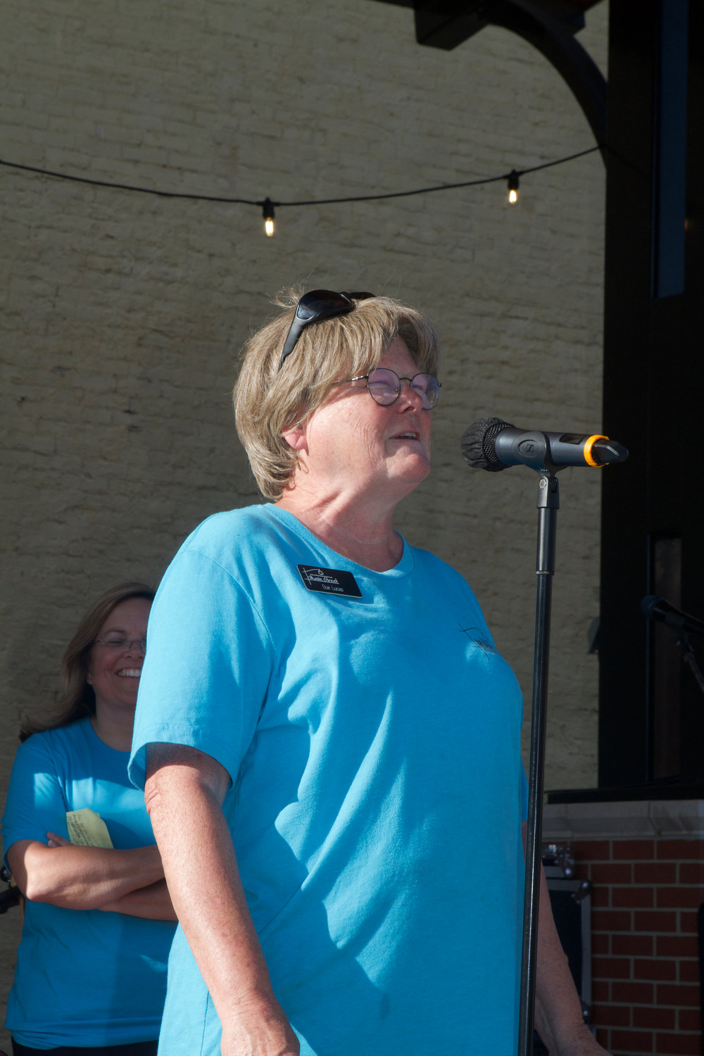 Sue Lucas, Crawfordsville Main Street director, welcomes the crowd to the First Friday event.