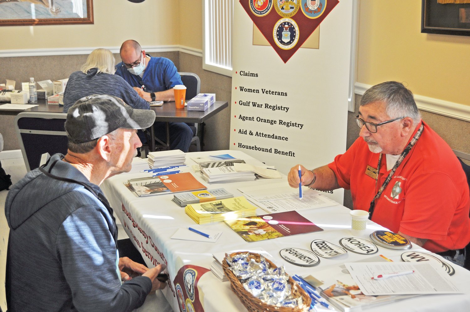 Joe Ellis, Montgomery County Veterans Service Officer, consults with a veteran at last year's Veterans Expo at Crawfordsville American Legion Byron Cox Post 72.